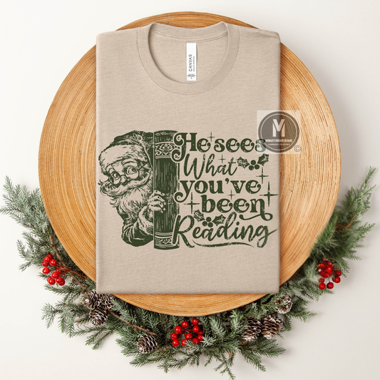 HE SEES WHAT YOU'VE BEEN READING