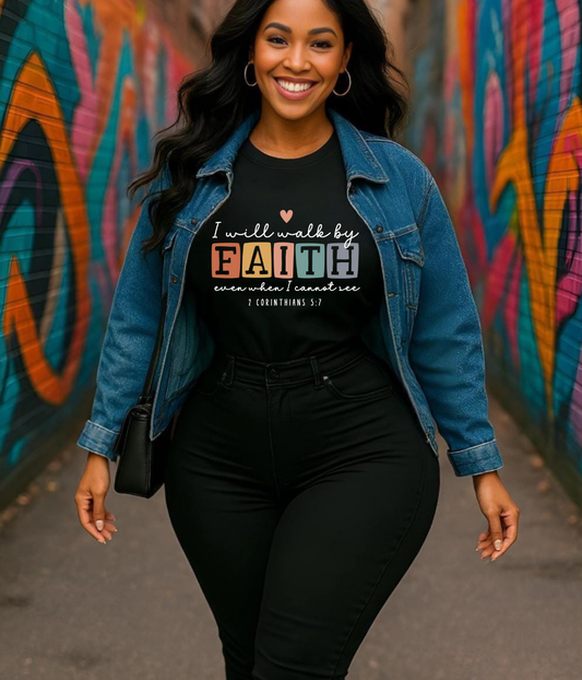 Woman wearing a black t-shirt with a motivational quote, standing in front of a colorful graffiti wall.