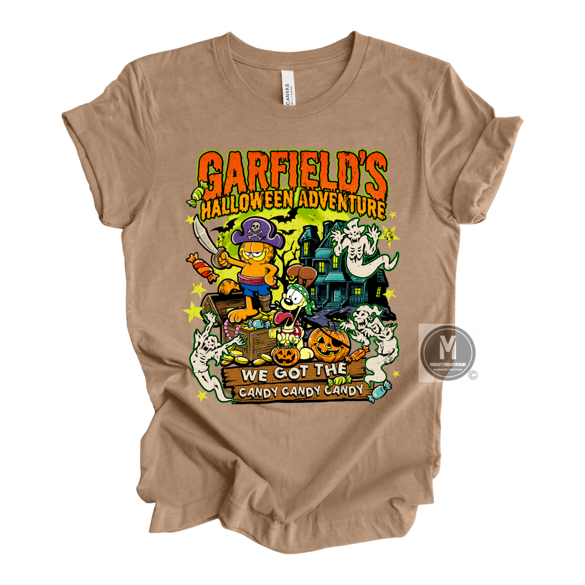 A brown short-sleeve graphic t-shirt featuring 'Garfield's Halloween Adventure' with cartoon Garfield, a purple witch hat, a haunted house, pumpkins, and the phrase 'We Got the Candy Candy Candy'.